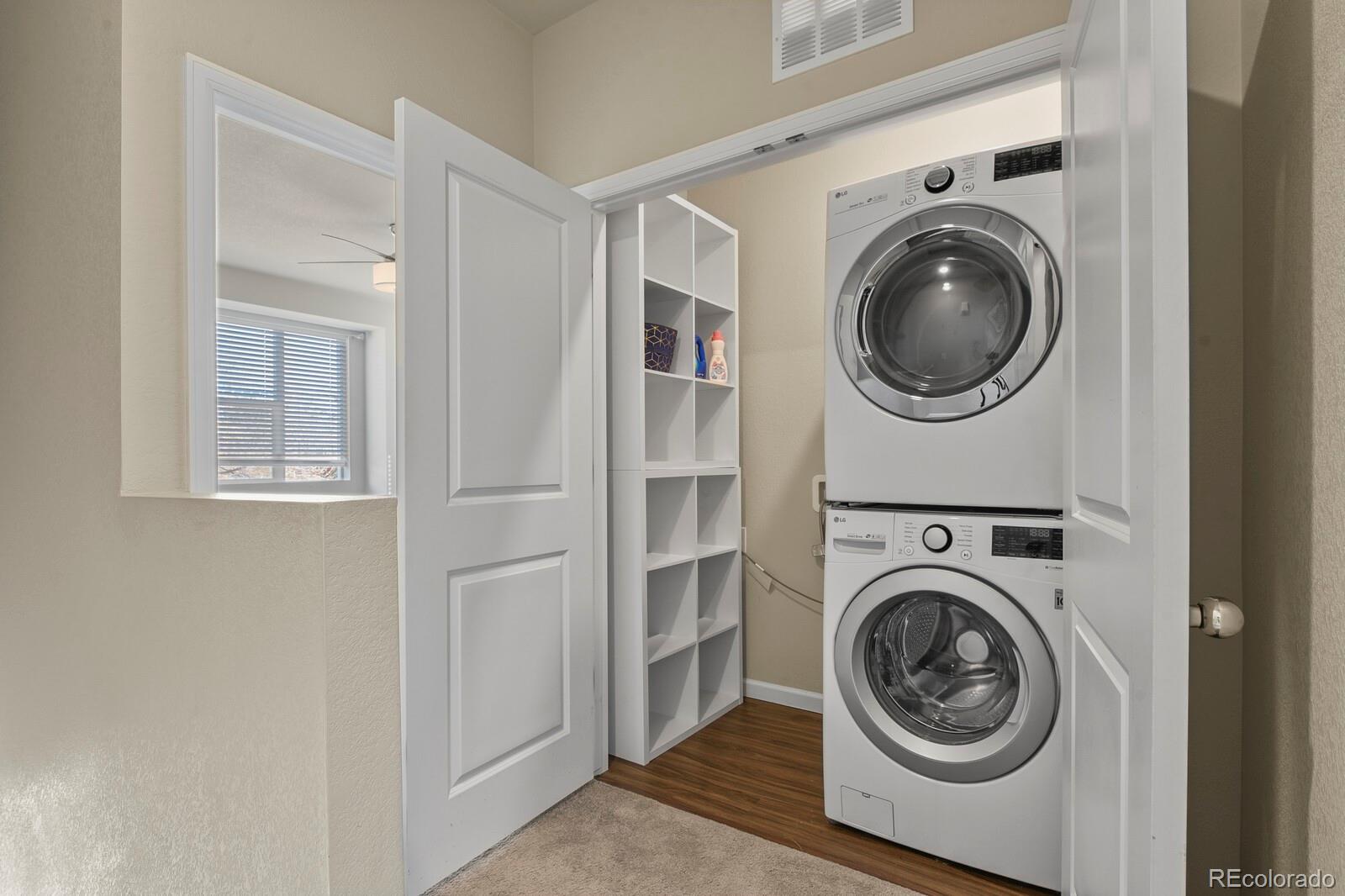 1078 Oak Circle Denver, CO 80215 - Photo 17 of 29 a view of a hallway with washer and dryer