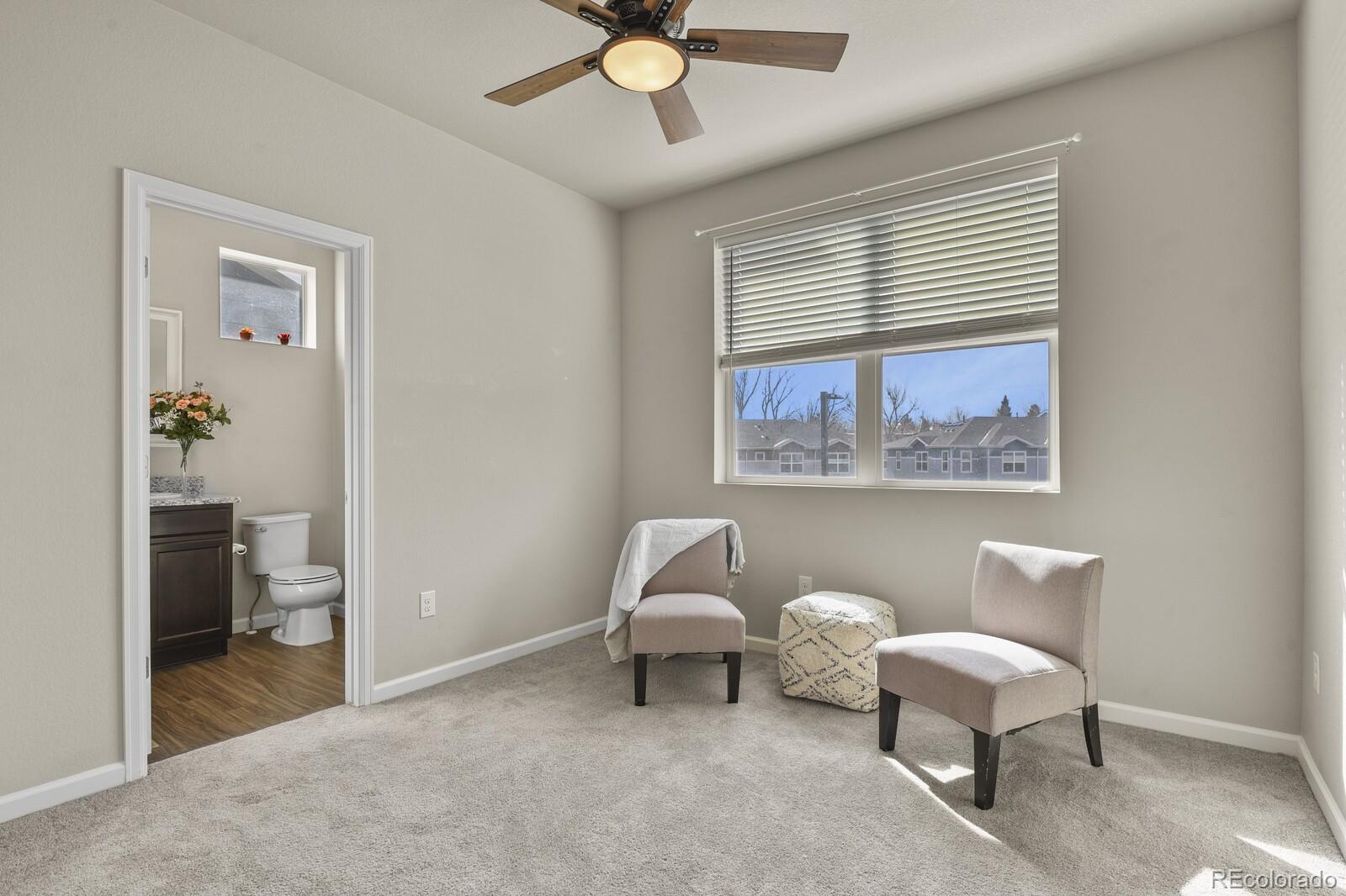 1078 Oak Circle Denver, CO 80215 - Photo 18 of 29 a living room with furniture and a window