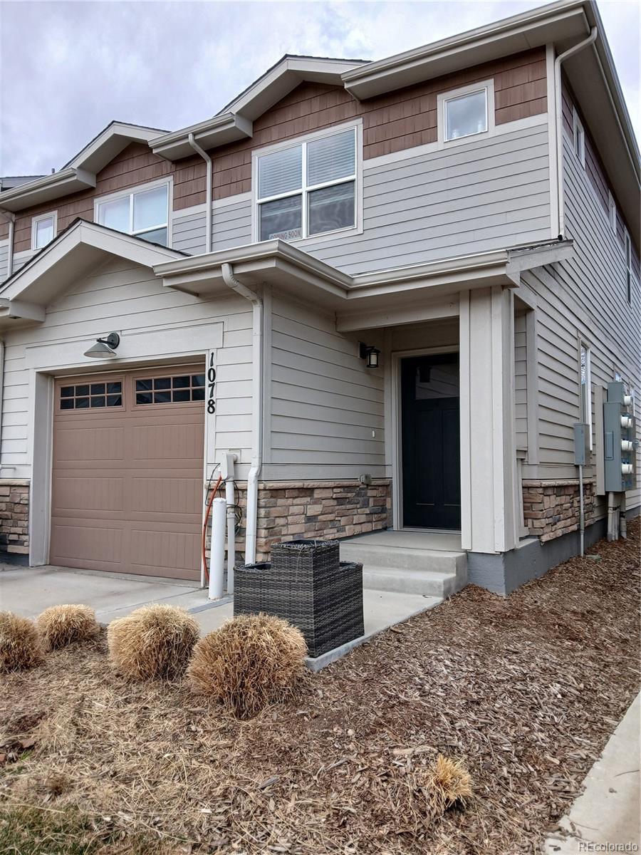 1078 Oak Circle Denver, CO 80215 - Photo 3 of 29 a front view of a house with garage