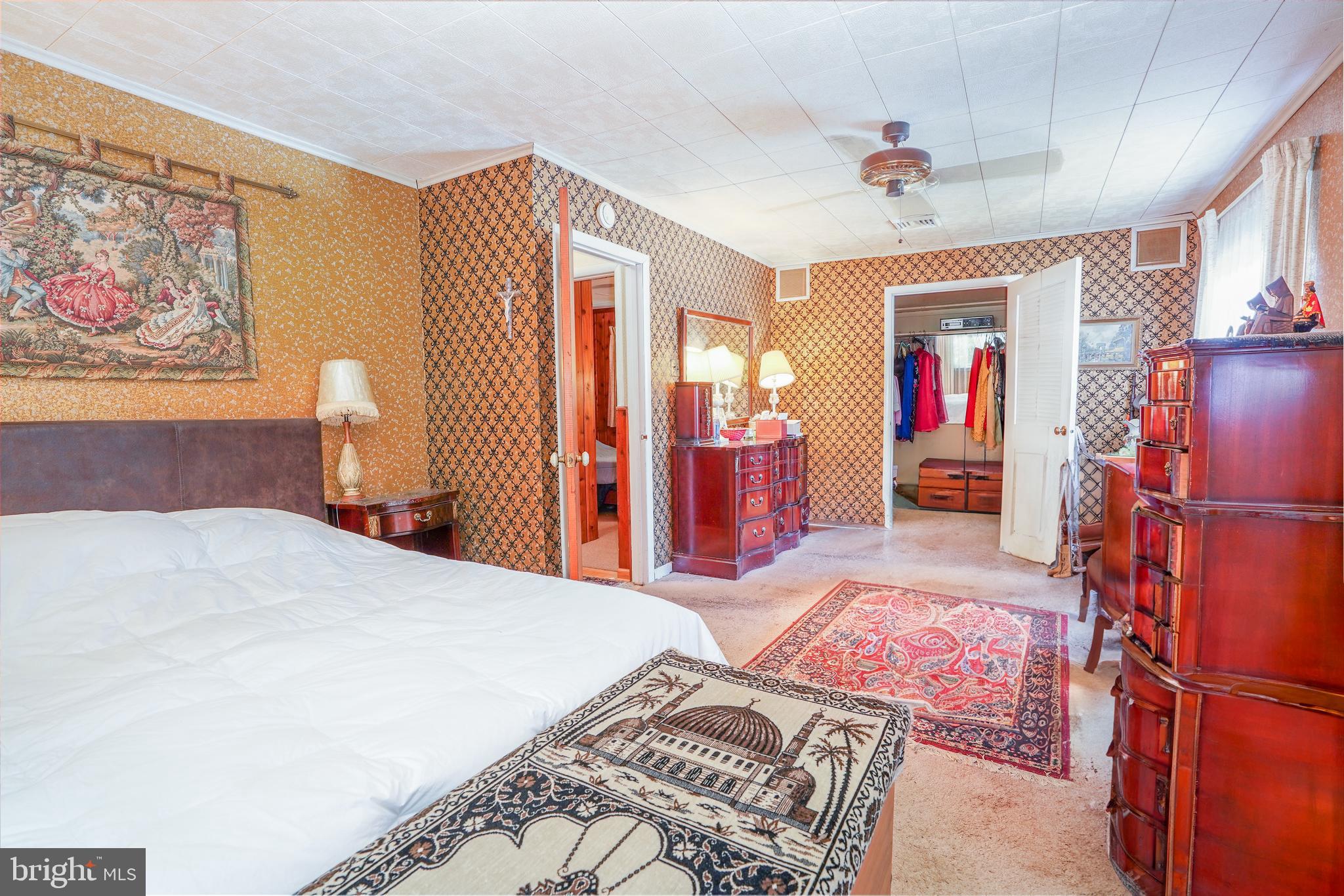 10 Taunton Road Medford, NJ 08055 - Photo 24 of 44 a bedroom with a bed and a chandelier