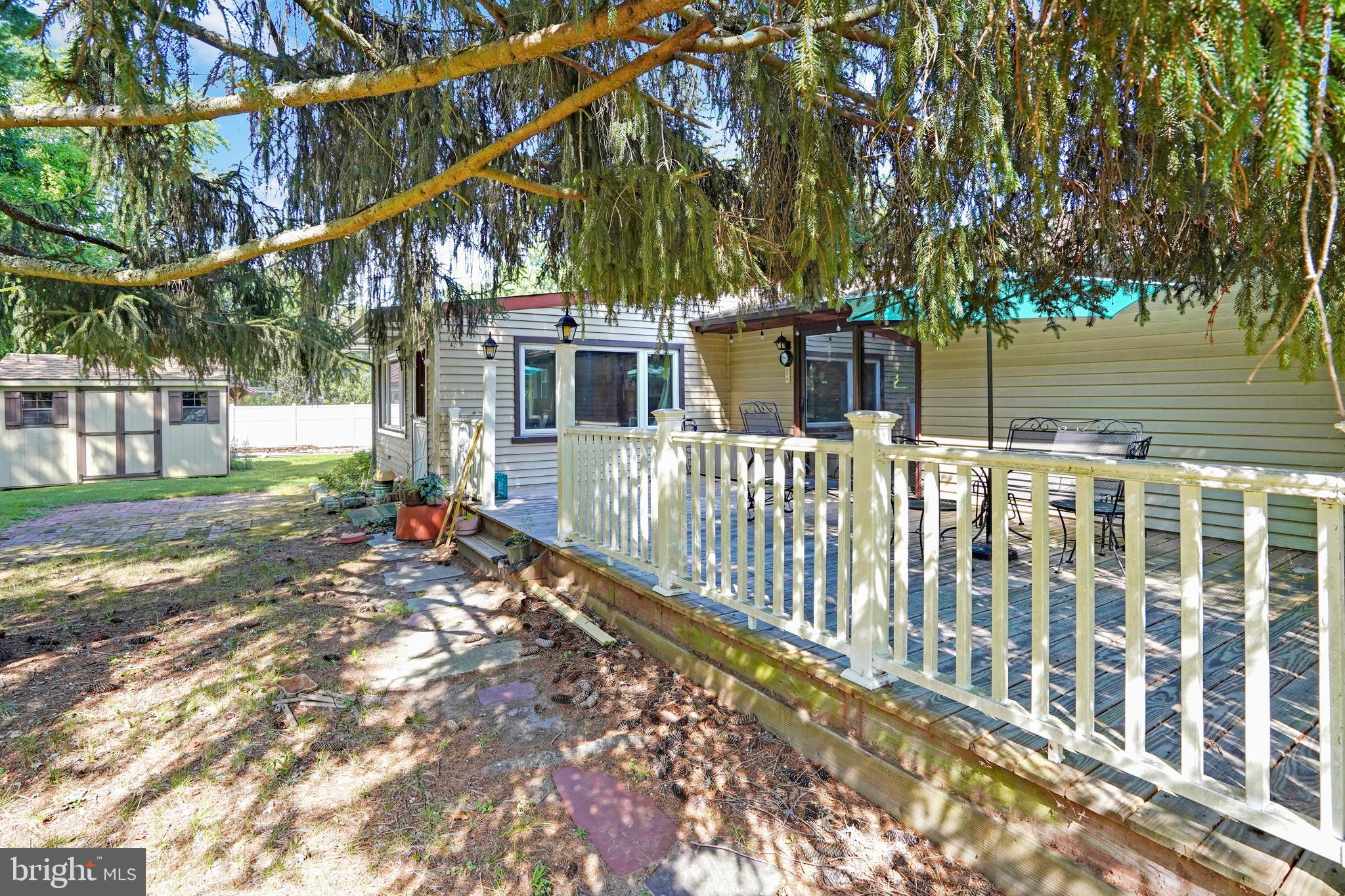 10 Taunton Road Medford, NJ 08055 - Photo 36 of 44 a view of a house with a small yard and wooden fence