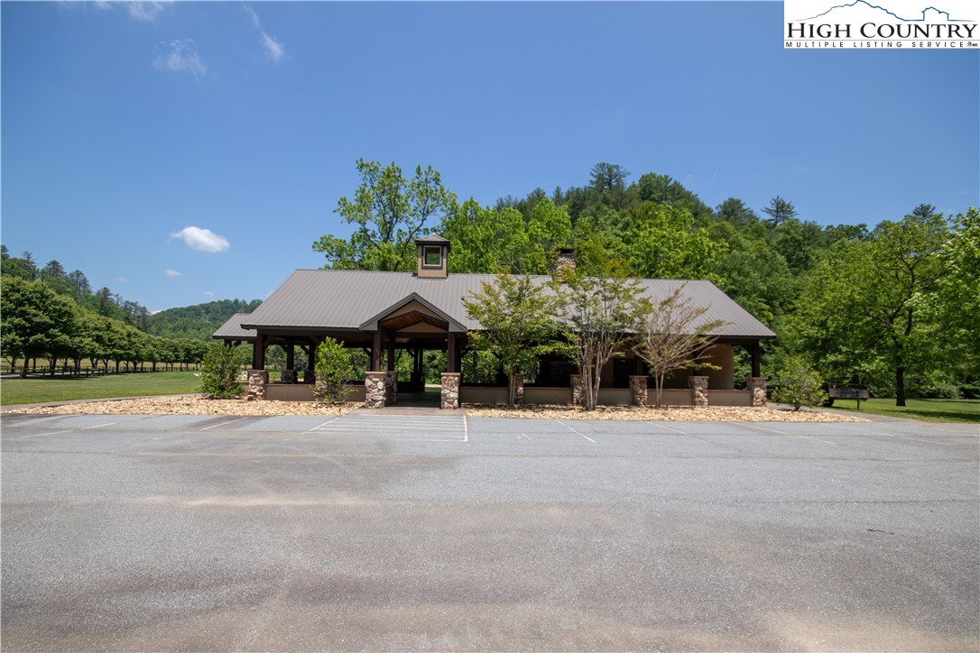 Lot#547 Autumn Ridge Drive Lenoir, NC 28645 - Photo 43 of 50 a backyard of a house with yard and outdoor seating