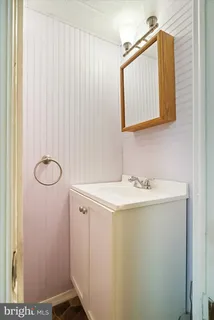 a bathroom with a sink and mirror