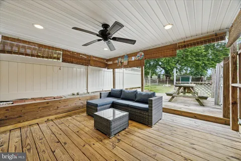 a living room with couch and wooden floor