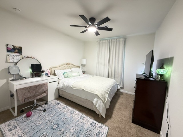 6415 Kentfield Drive Rosharon, TX 77583 - Photo 15 of 21 Well-sized secondary bedroom featuring carpet flooring, modern ceiling fan, and a bright window — a great space for guests or family