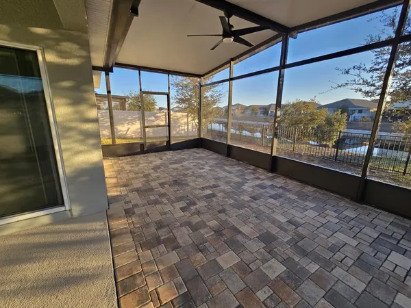 an aerial view of a house with a swimming pool