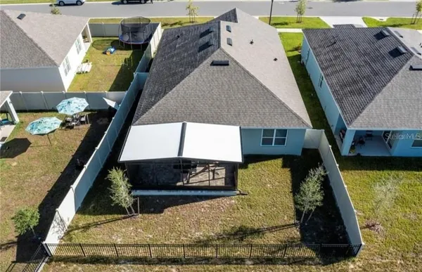 an aerial view of a houses with outdoor space