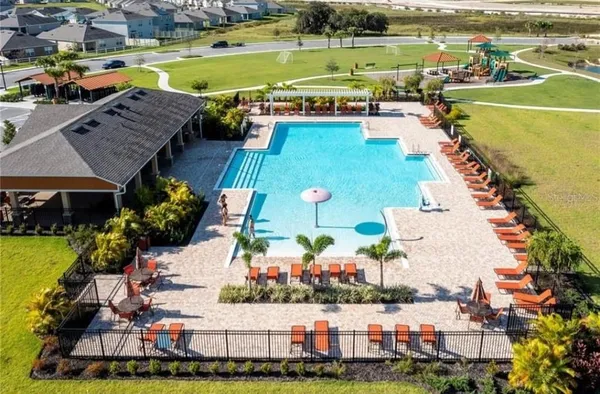 an aerial view of a city with lawn chairs