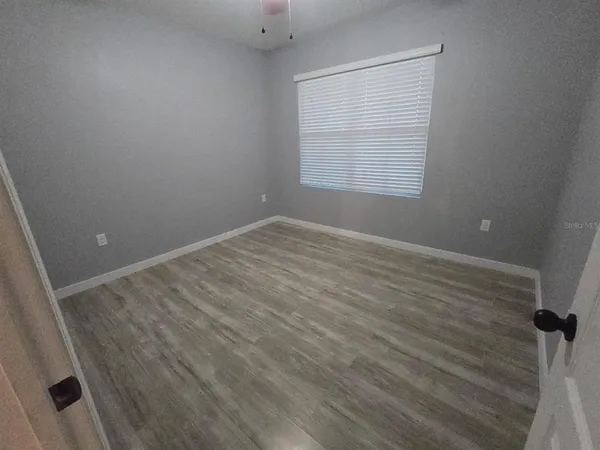 wooden floor and window in a room