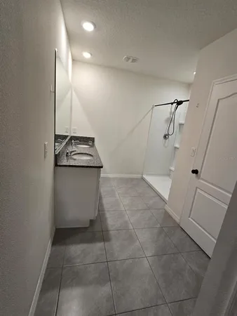 a view of a storage & utility room with a sink