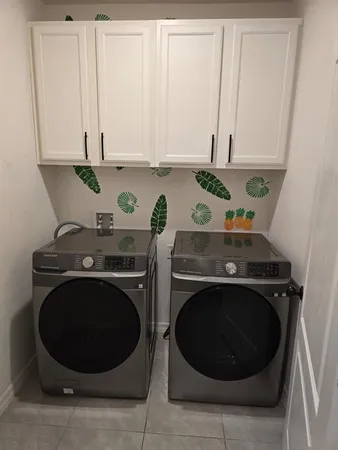 a stove top oven sitting inside of a kitchen