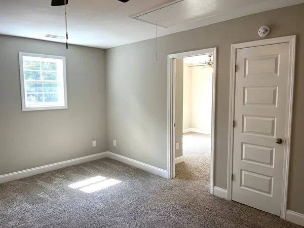 a view of an empty room with a window