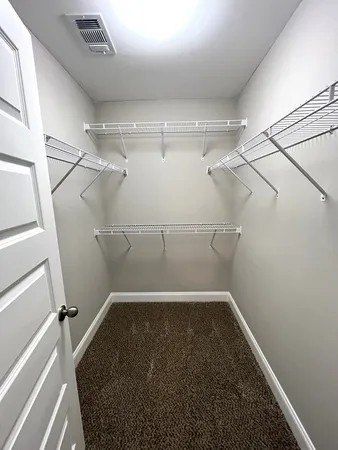 a view of a room with racks on the wall