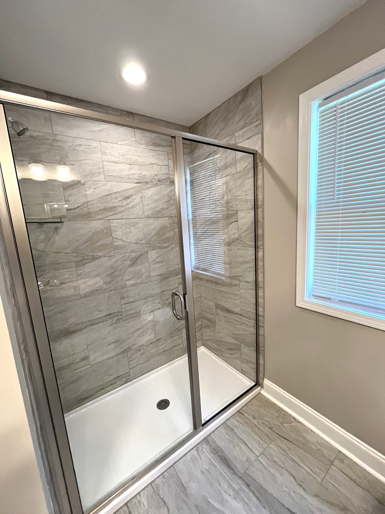 4024 Valley Road Columbus, GA 31907 - Photo 30 of 35 a bathroom with a glass shower door