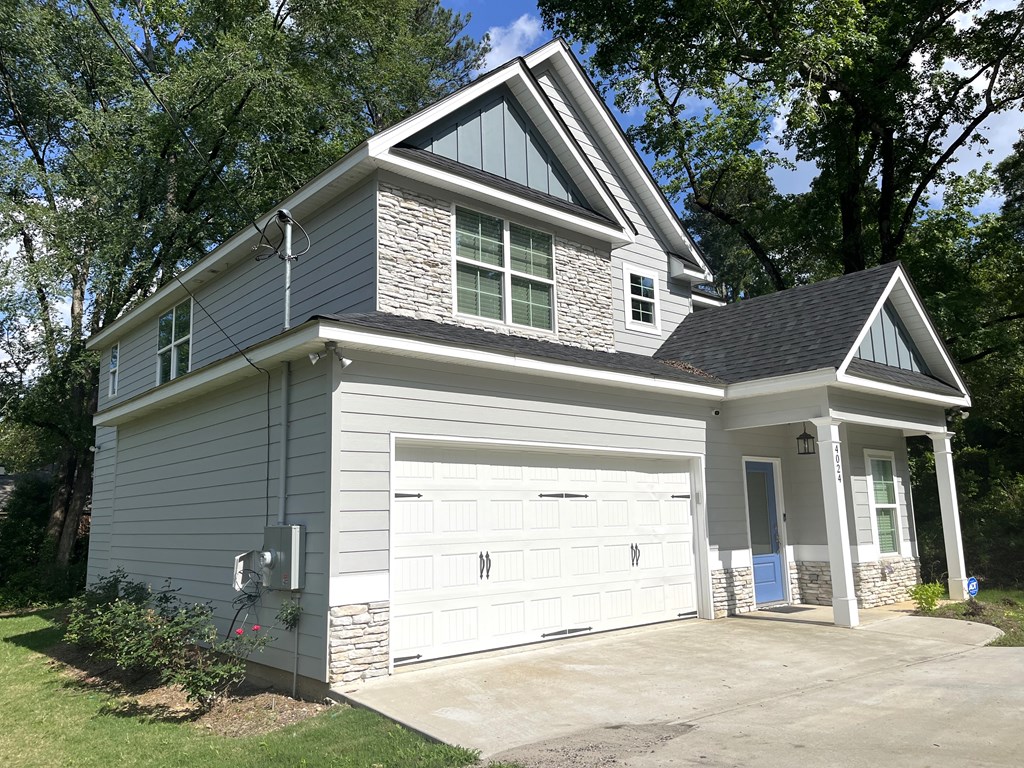 4024 Valley Road Columbus, GA 31907 - Photo 4 of 35 a view of a house with a yard plants and large tree