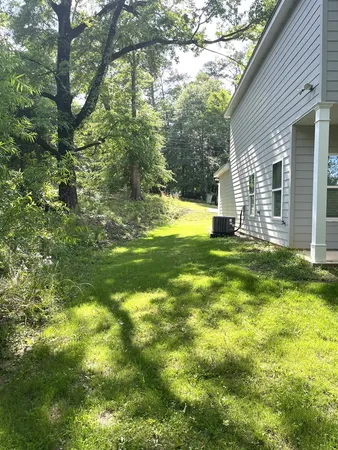 a backyard of a house with lots of green space