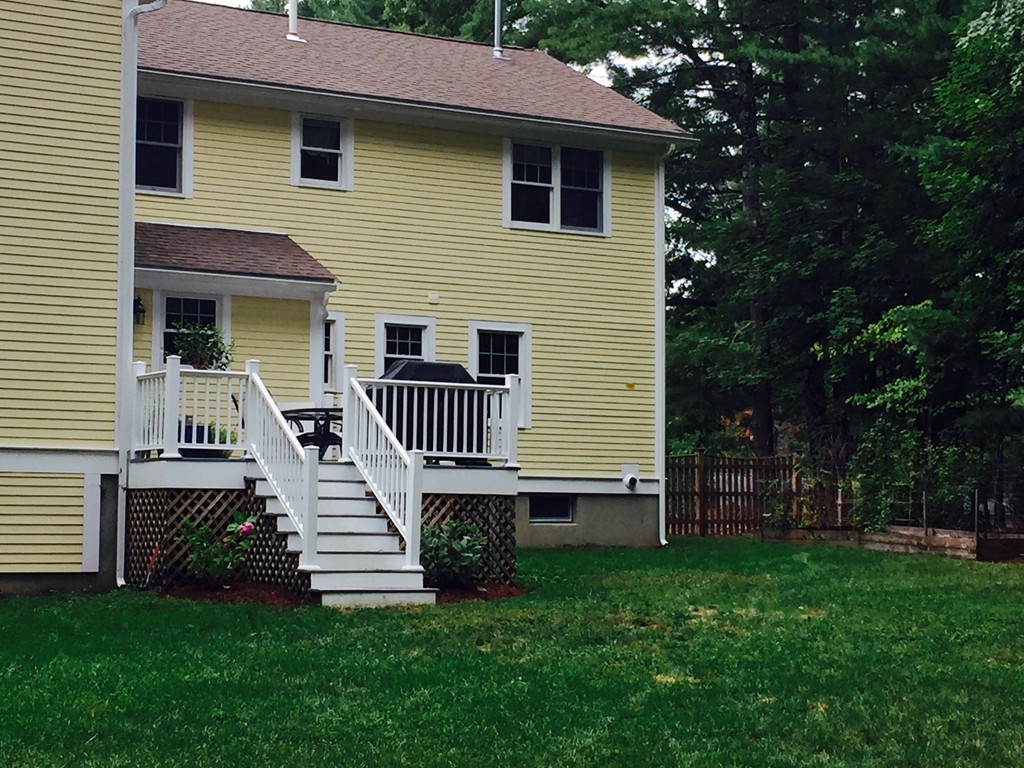 66 Jarman Road Sudbury, MA 01776 - Photo 27 of 30 a front view of a house with garden