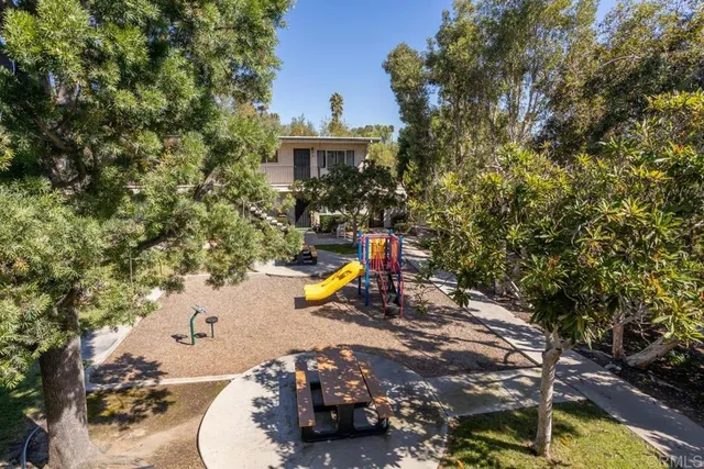 a view of a swimming pool with a patio