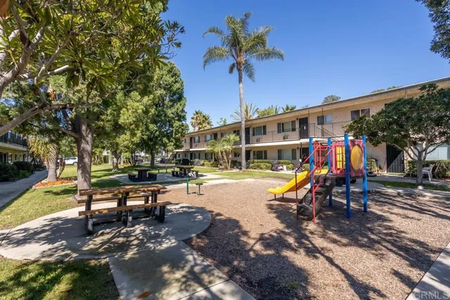 a view of a swimming pool with a bench and a slide