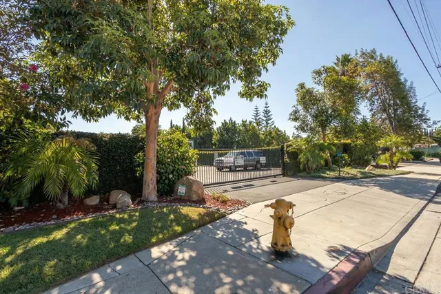 a swimming pool with a yard and trees
