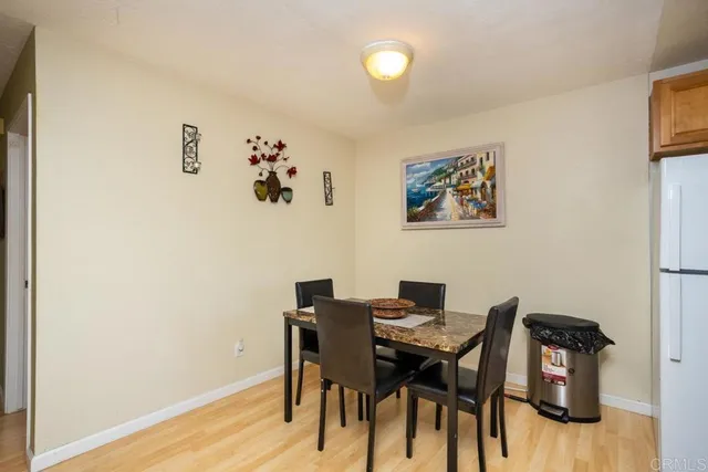 a view of a workspace with furniture and wooden floor