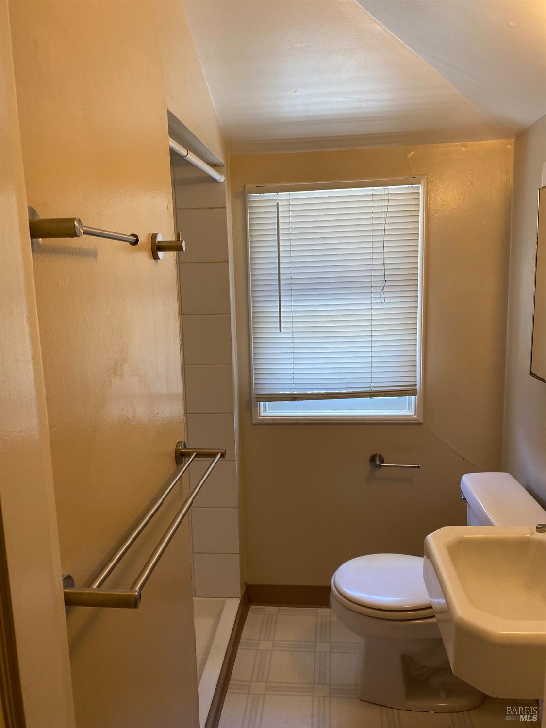 618 Benton Street Santa Rosa, CA 95404 - Photo 25 of 27 a bathroom with a toilet and a shower
