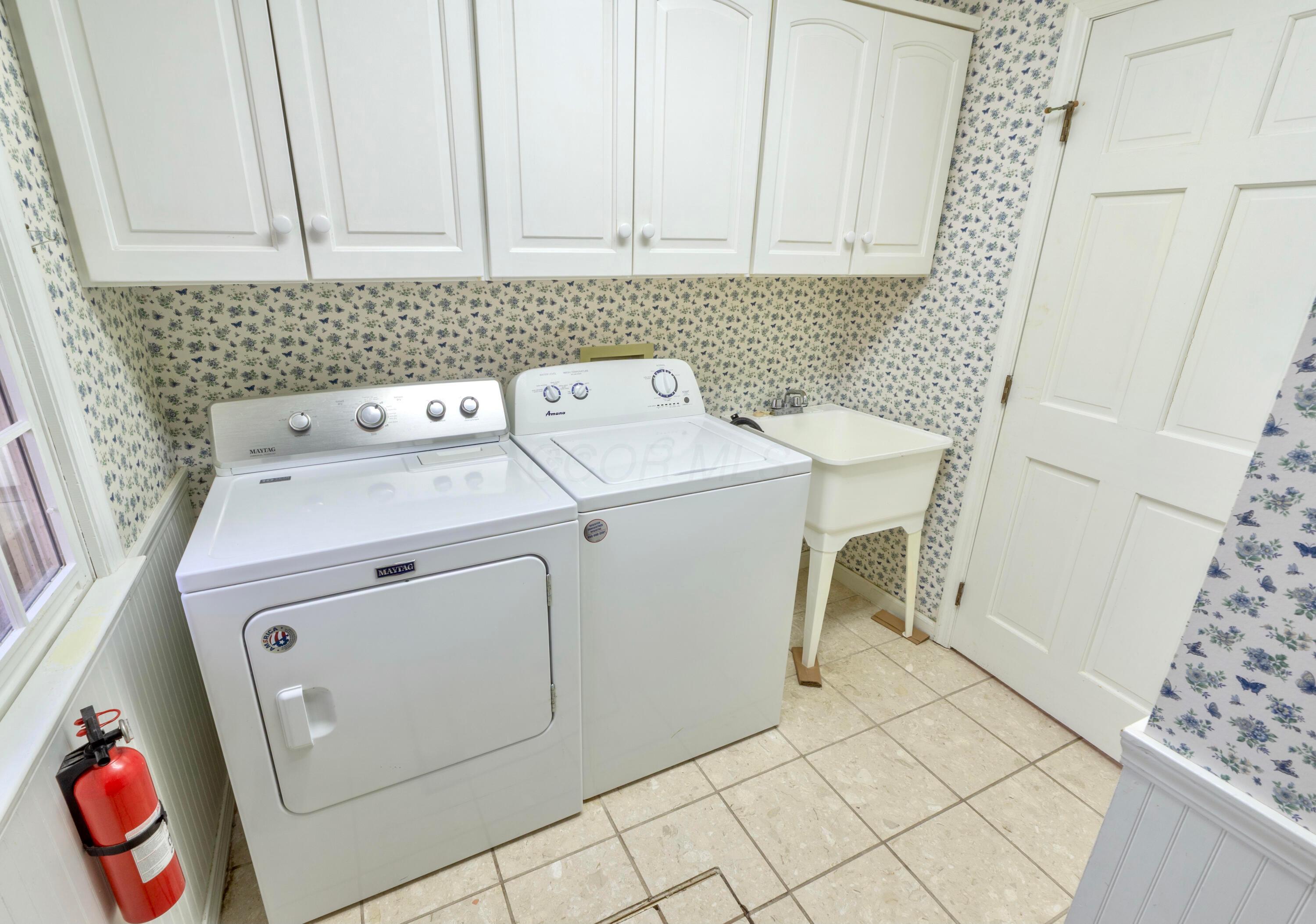 3880 Fry Road Ostrander, OH 43061 - Photo 20 of 82 Laundry room is off the kitchen. Utility sink is handy.