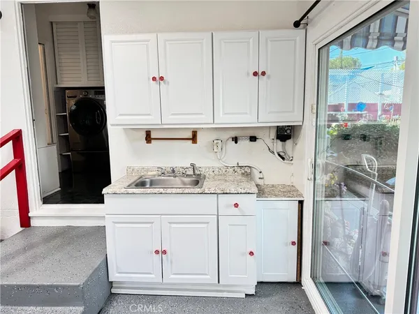 a view of entryway wih livingroom and stairs