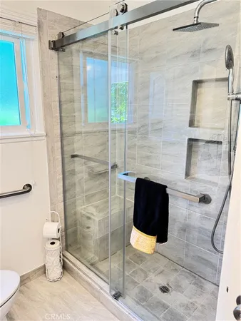 a view of a house with a yard and garden