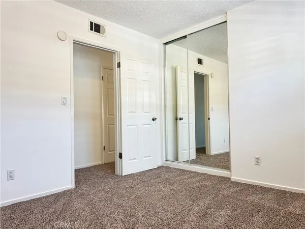 a backyard of a house with entertaining space and outdoor seating