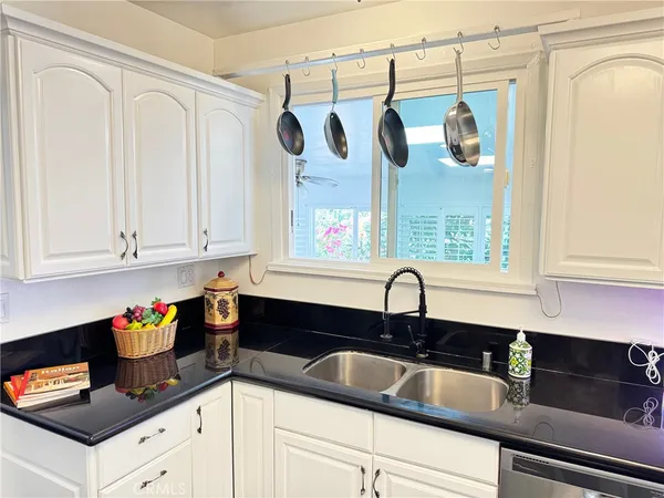 a kitchen with a sink and cabinets