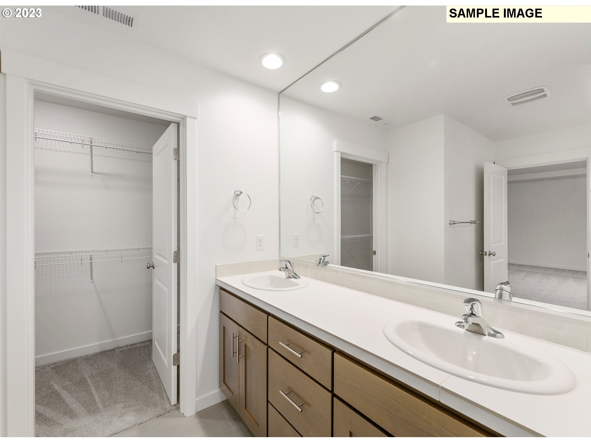 219 North 89th Loop, Unit 82 Ridgefield, WA 98642 - Photo 15 of 32 a bathroom with a sink and a mirror