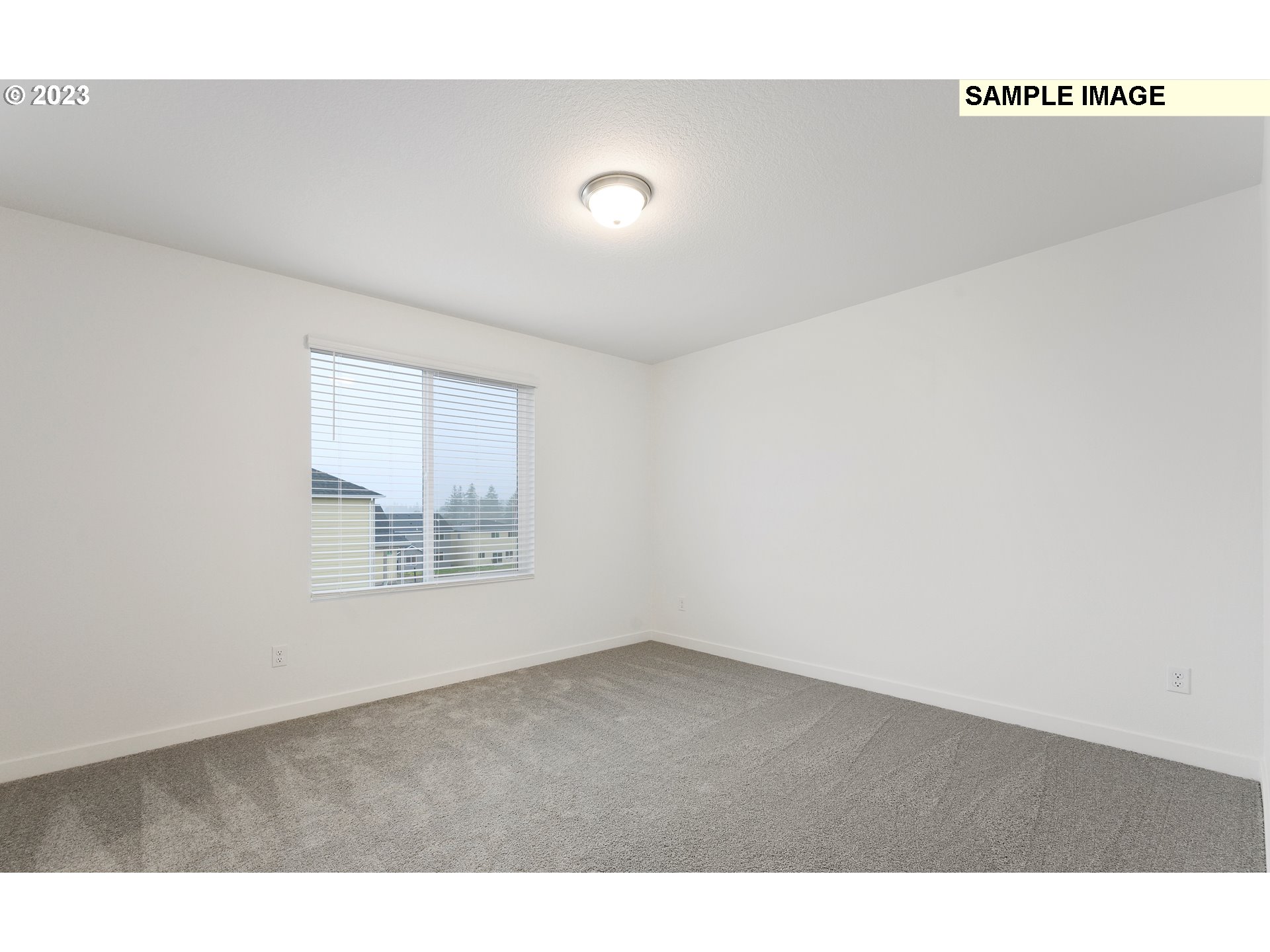 219 North 89th Loop, Unit 82 Ridgefield, WA 98642 - Photo 16 of 32 a view of an empty room with a window