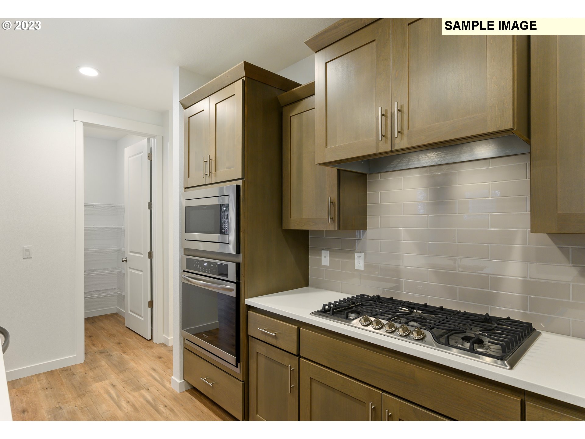 219 North 89th Loop, Unit 82 Ridgefield, WA 98642 - Photo 3 of 32 a kitchen with stainless steel appliances granite countertop a refrigerator and a stove top oven