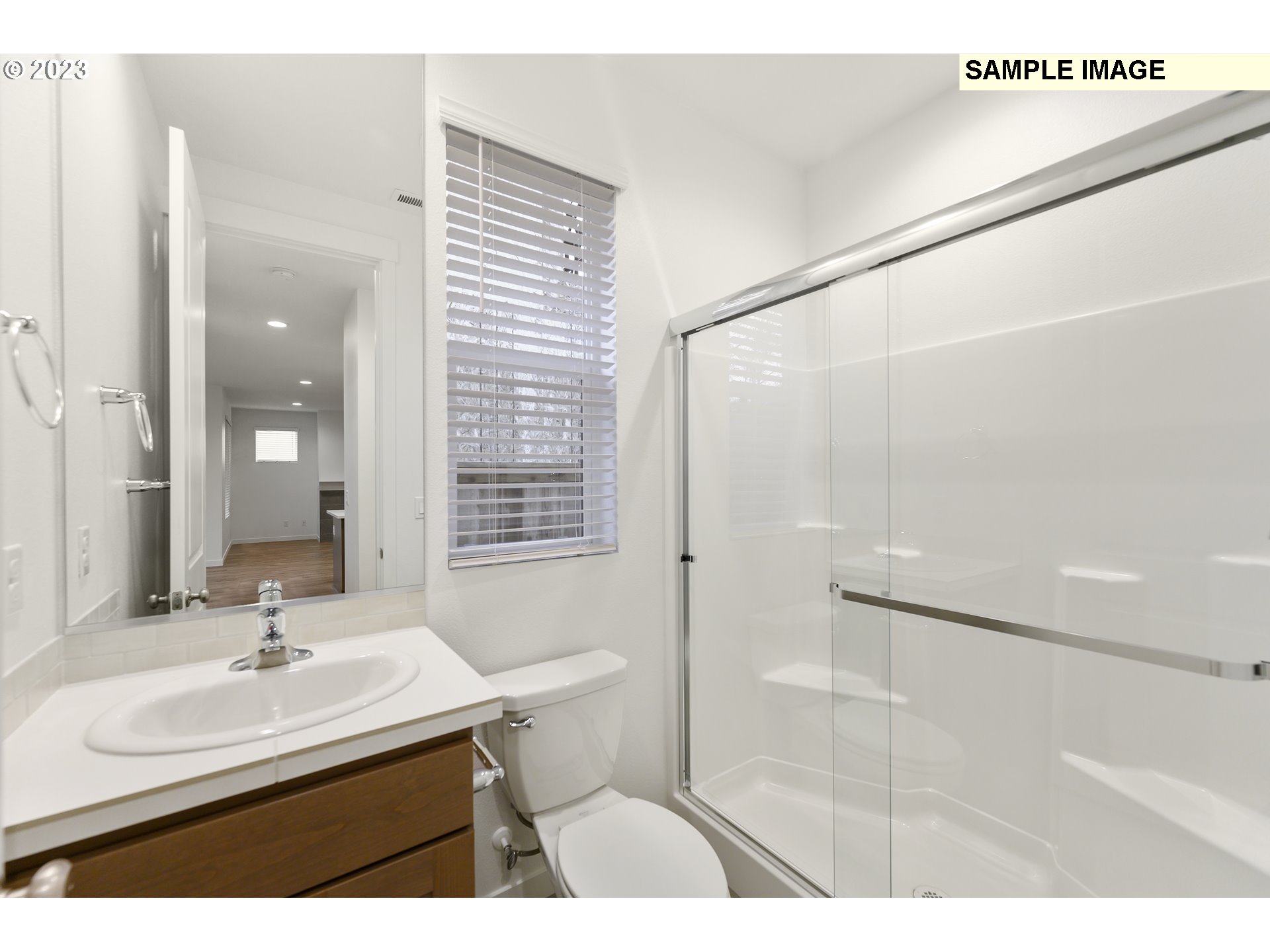 219 North 89th Loop, Unit 82 Ridgefield, WA 98642 - Photo 32 of 32 a bathroom with a sink mirror toilet and shower