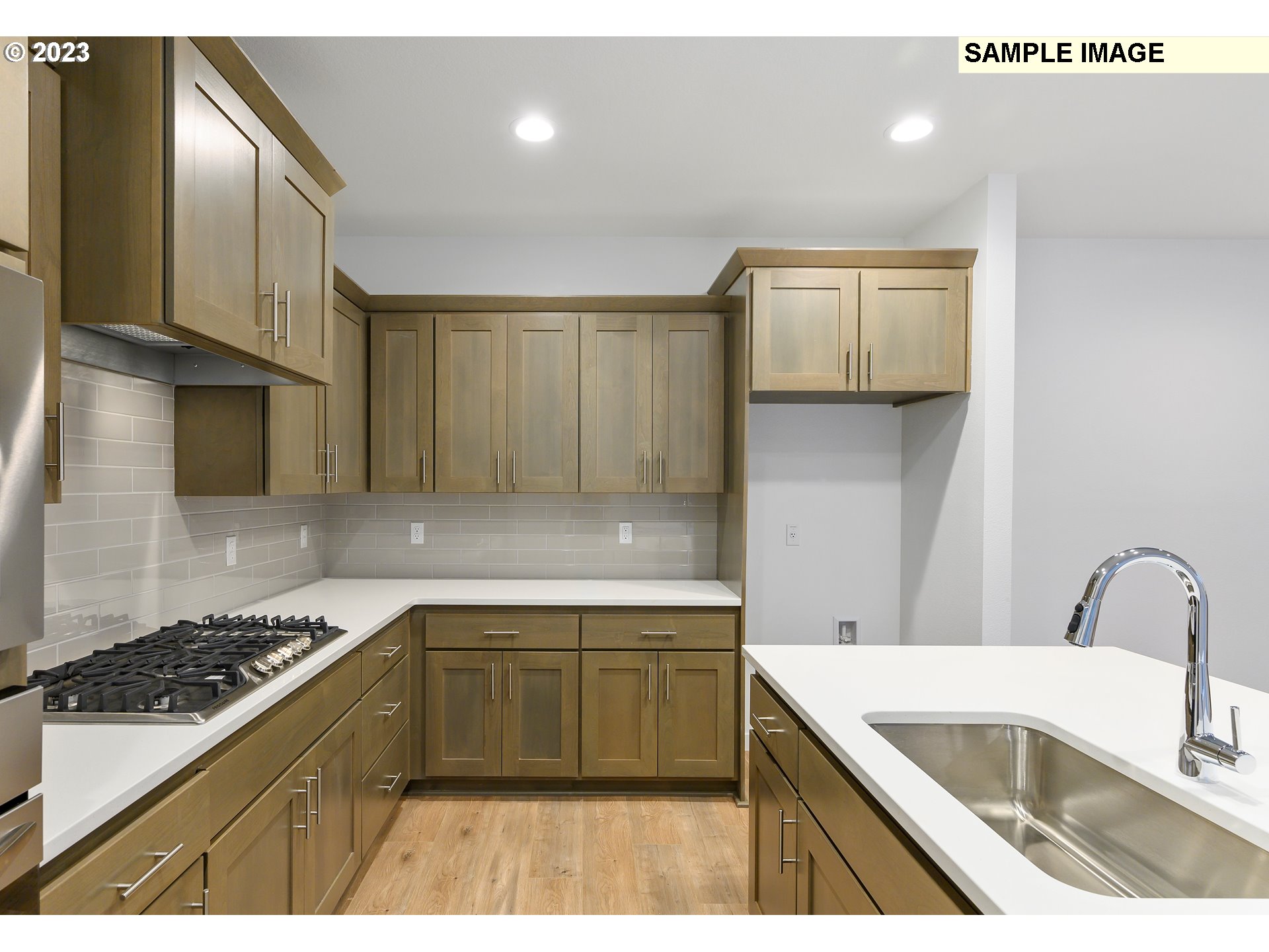 219 North 89th Loop, Unit 82 Ridgefield, WA 98642 - Photo 4 of 32 a kitchen with a sink cabinets and window