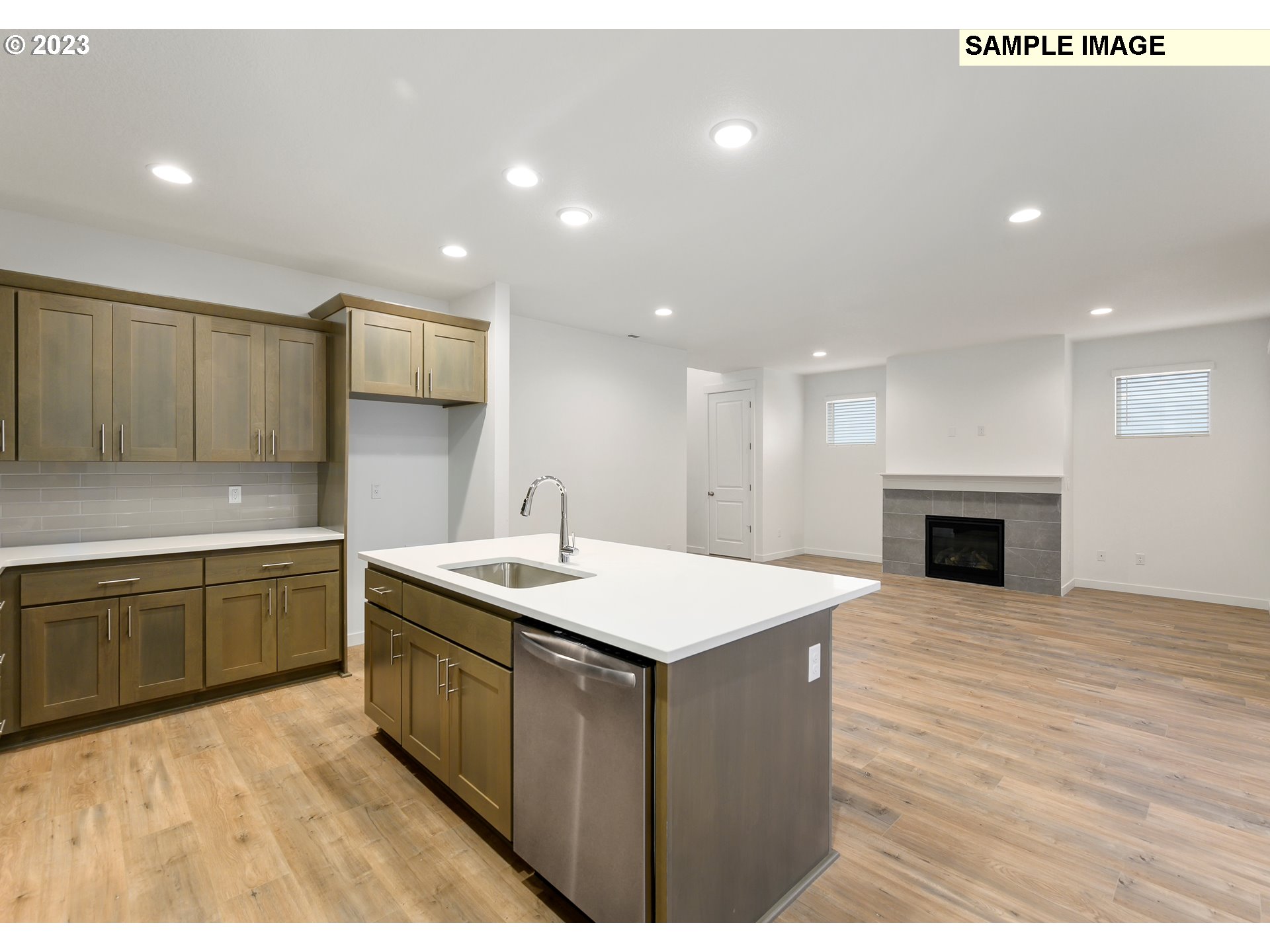 219 North 89th Loop, Unit 82 Ridgefield, WA 98642 - Photo 7 of 32 a kitchen with a sink and a stove top oven