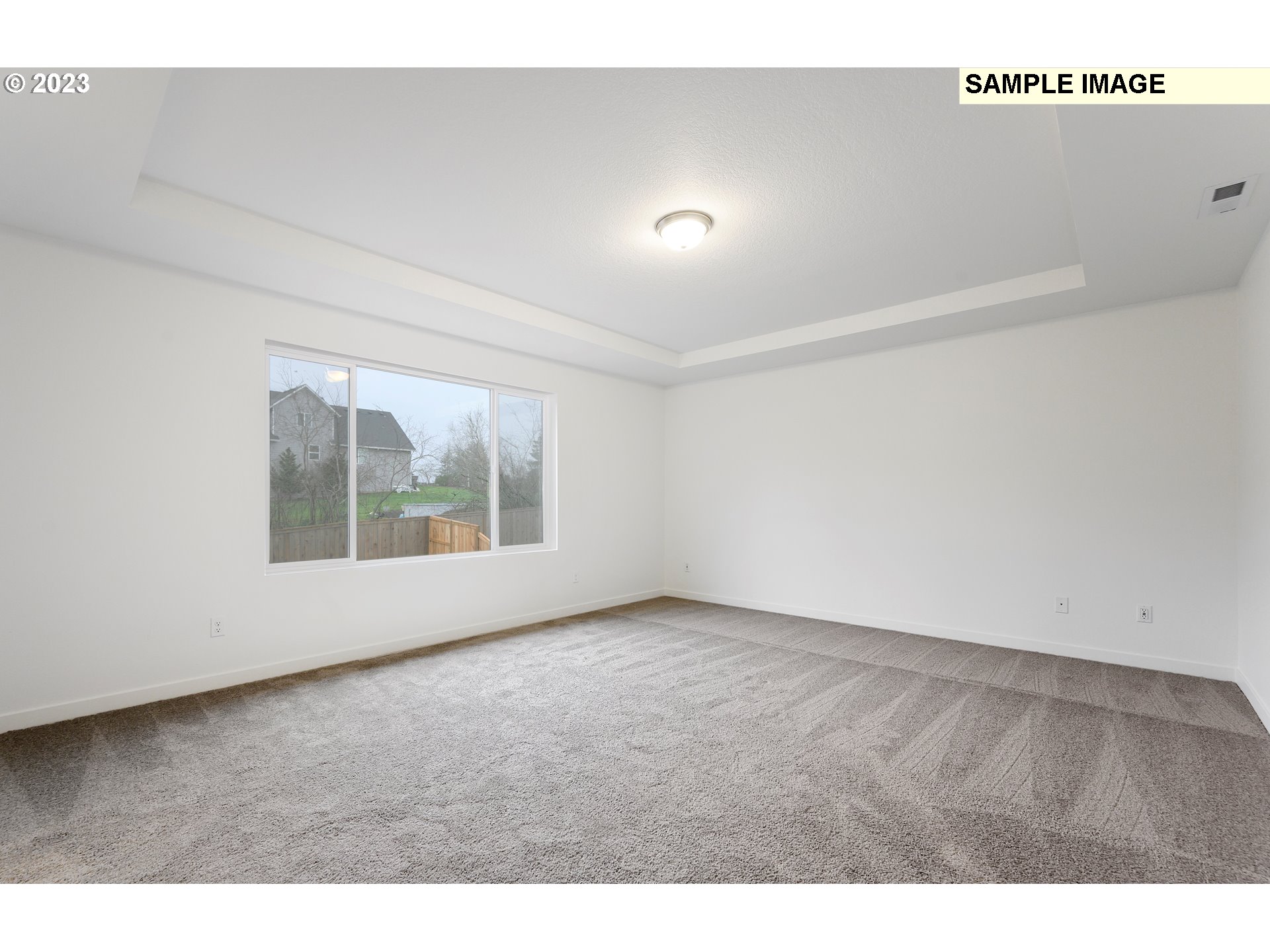 219 North 89th Loop, Unit 82 Ridgefield, WA 98642 - Photo 8 of 32 a view of an empty room with a window