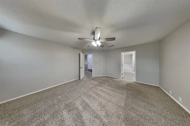 a view of a livingroom with a chandelier fan