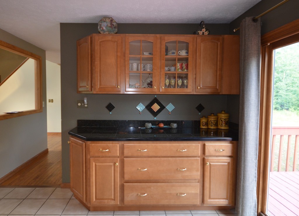 350 Warren Wright Road Belchertown, MA 01007 - Photo 12 of 30 a kitchen with granite countertop a sink and cabinets