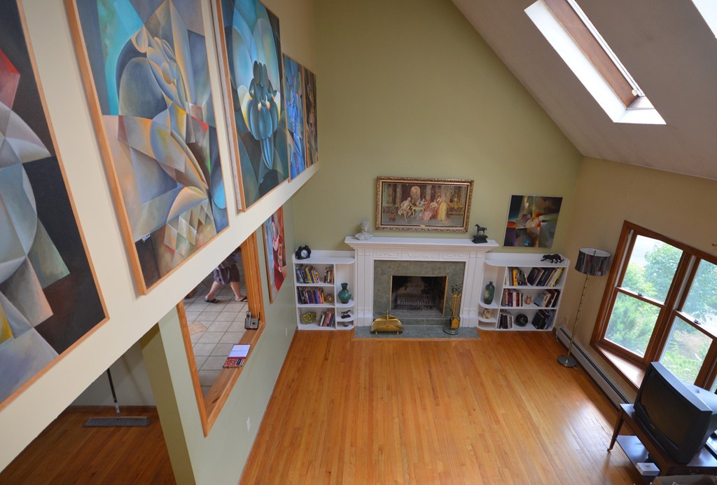 350 Warren Wright Road Belchertown, MA 01007 - Photo 2 of 30 a living room with furniture and a fireplace
