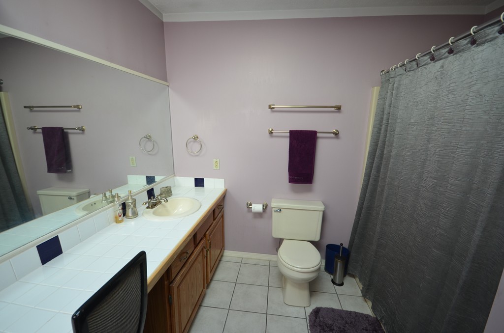 350 Warren Wright Road Belchertown, MA 01007 - Photo 25 of 30 a bathroom with a toilet sink and mirror