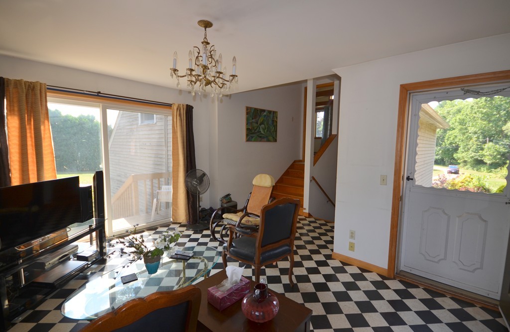 350 Warren Wright Road Belchertown, MA 01007 - Photo 7 of 30 a living room with furniture and a flat screen tv