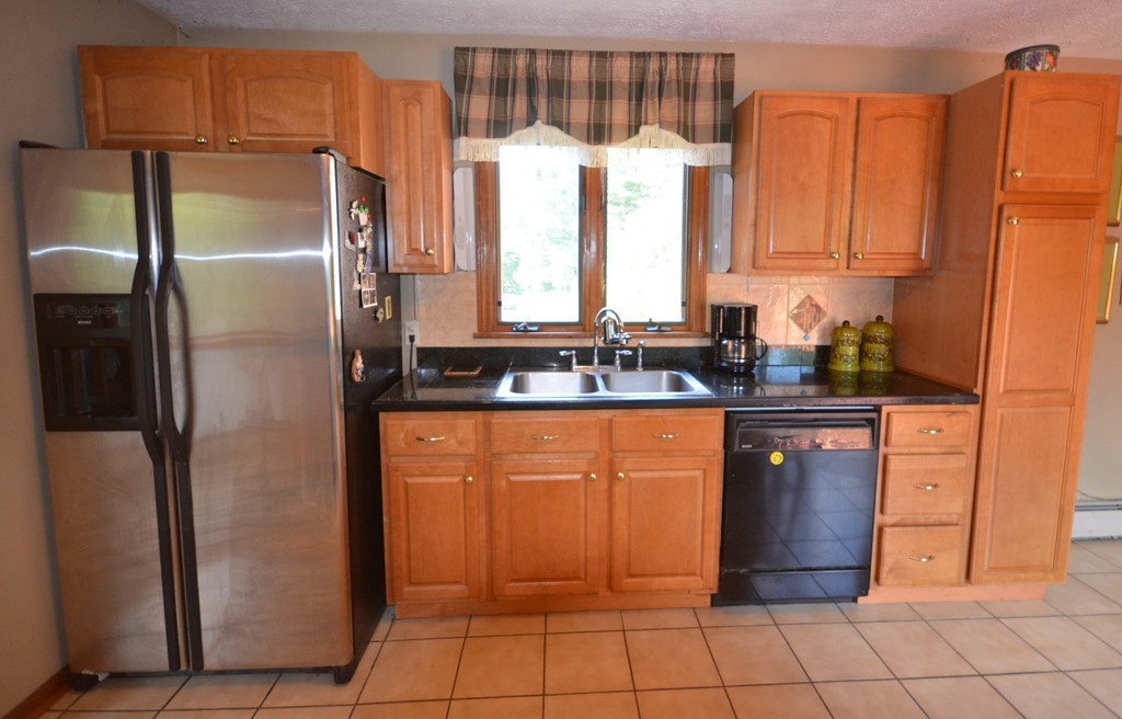 350 Warren Wright Road Belchertown, MA 01007 - Photo 10 of 30 a kitchen with stainless steel appliances granite countertop a refrigerator and a sink