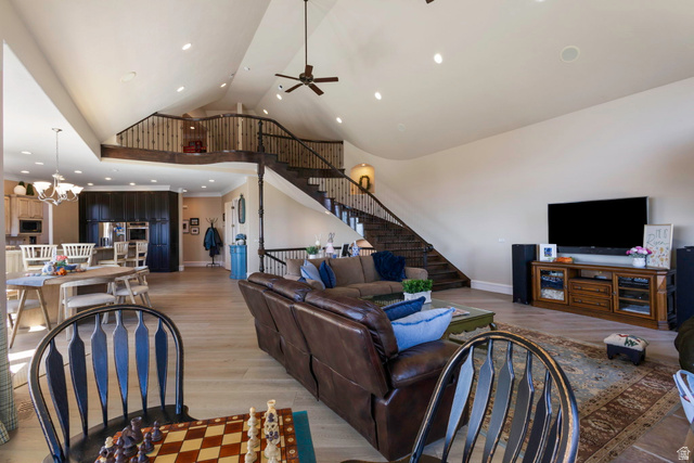 684 North Summit Way Alpine, UT 84004 - Photo 27 of 58 Living room with a high ceiling, light wood-style flooring, a ceiling fan, and suspended lighting