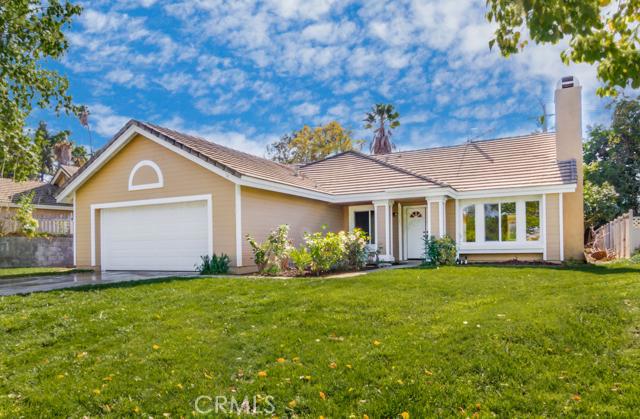 3570 Capriole Road Riverside, CA 92503 - Photo 1 of 1 a front view of a house with a garden and yard