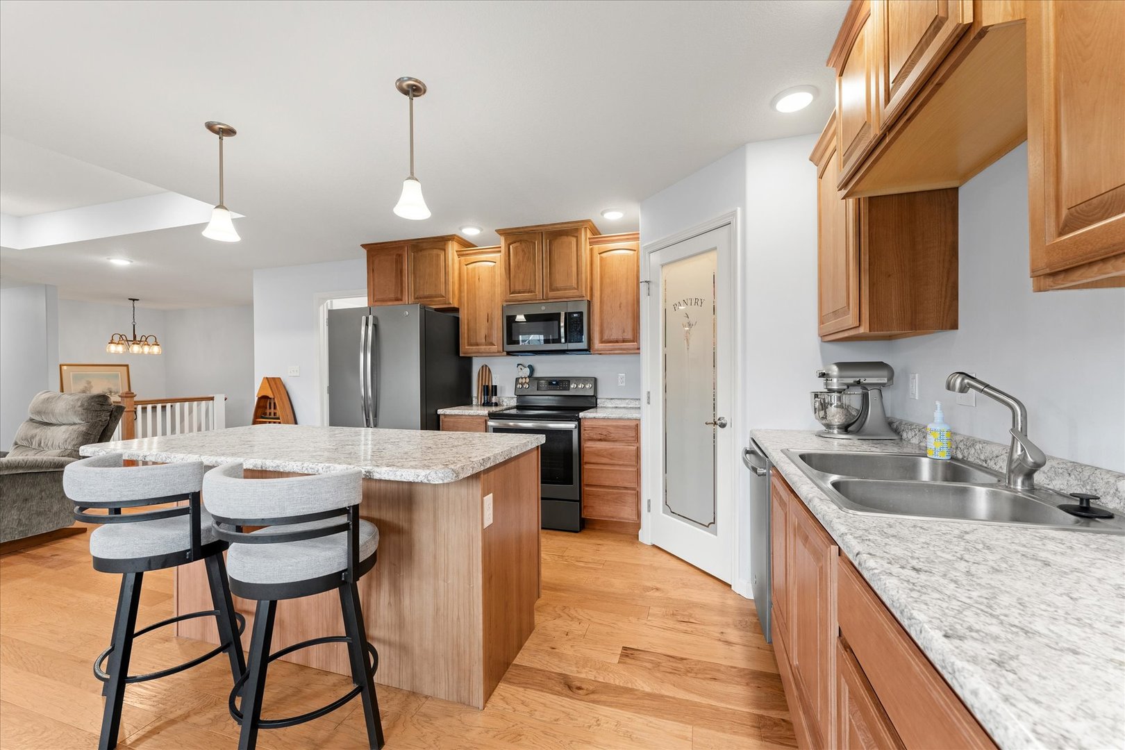 3503 South Deer Ridge Drive Urbana, IL 61802 - Photo 14 of 51 a kitchen that has a lot of cabinets a sink and appliances