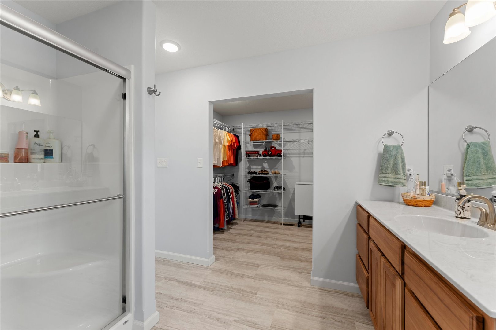 3503 South Deer Ridge Drive Urbana, IL 61802 - Photo 27 of 51 a view of a bathroom with a sink mirror and shower