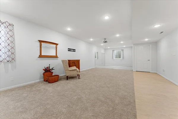 an empty room with furniture and a projector