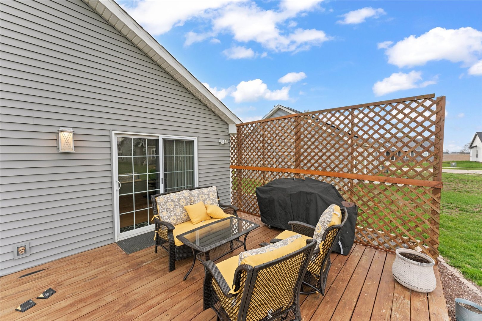 3503 South Deer Ridge Drive Urbana, IL 61802 - Photo 42 of 51 a balcony with wooden floor and outdoor seating